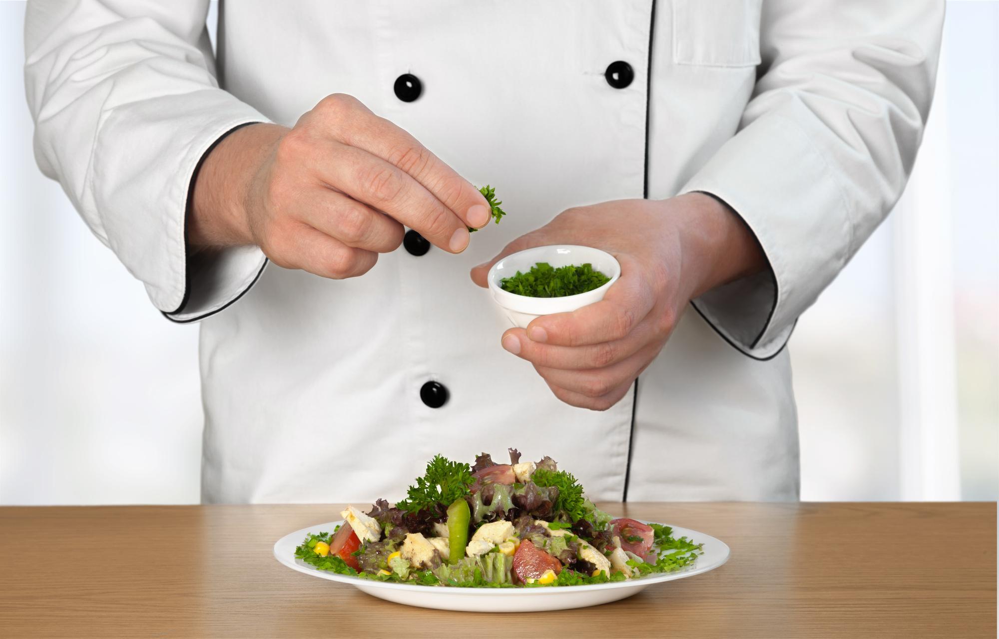 Instructor plating a salad